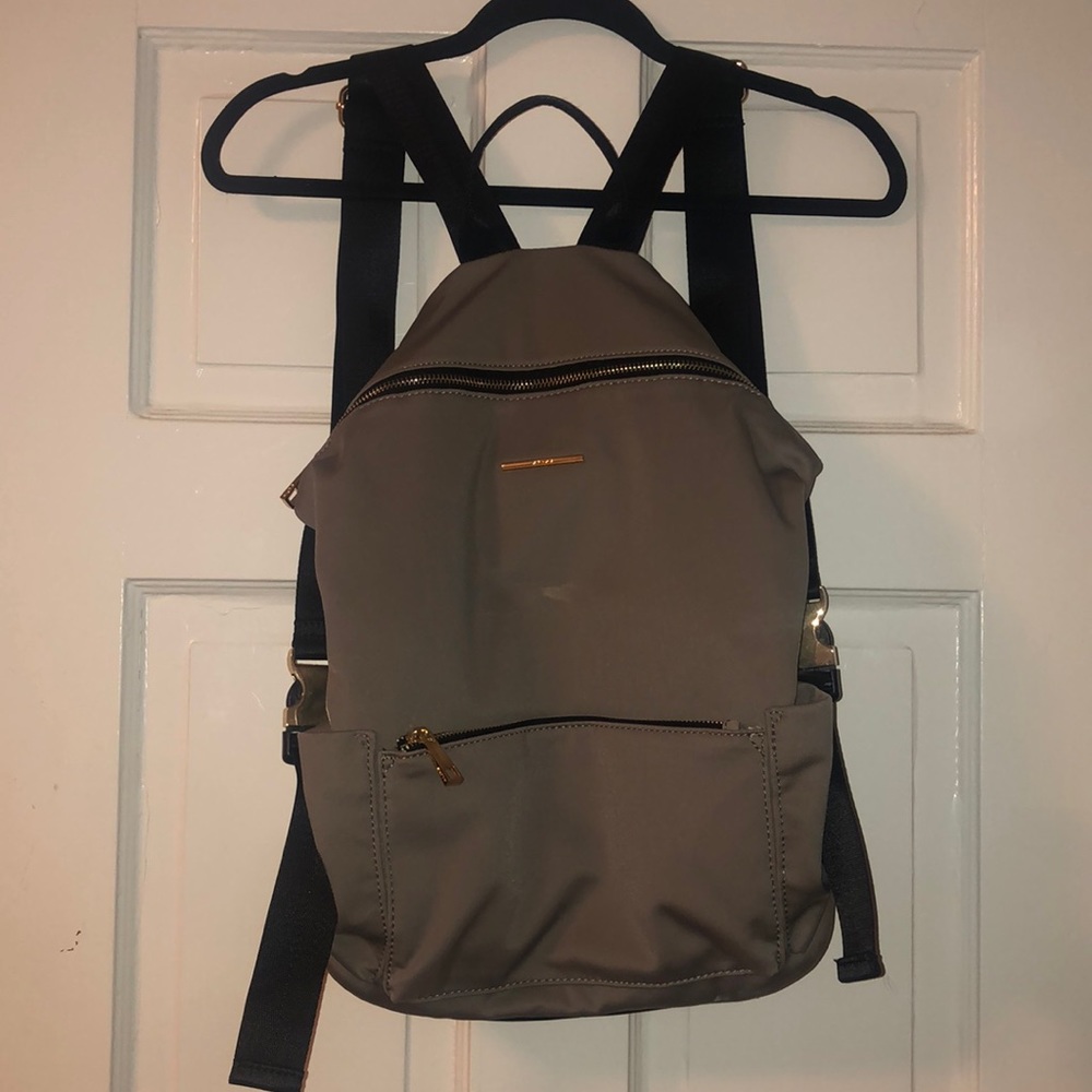 Aldo mauve gray backpack, with gold accents